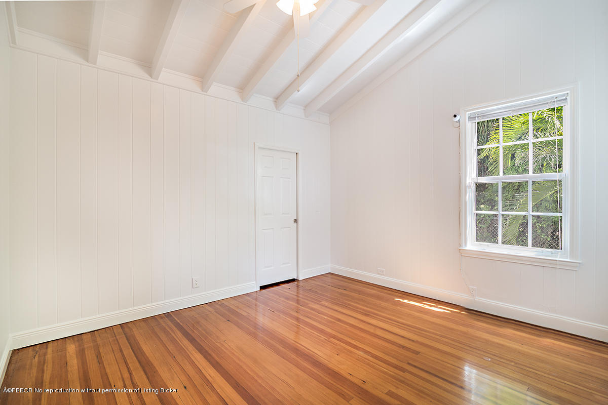 3130 Washington Road West Palm Beach, FL 33405 - Photo 15 of 33 an empty room with wooden floor and windows