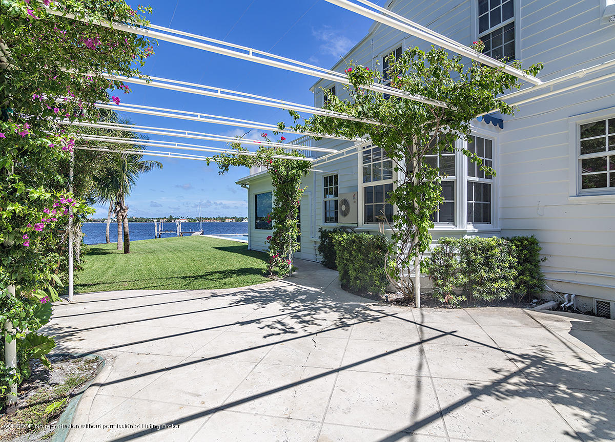 3130 Washington Road West Palm Beach, FL 33405 - Photo 19 of 33 a view of a porch with a bench and plants
