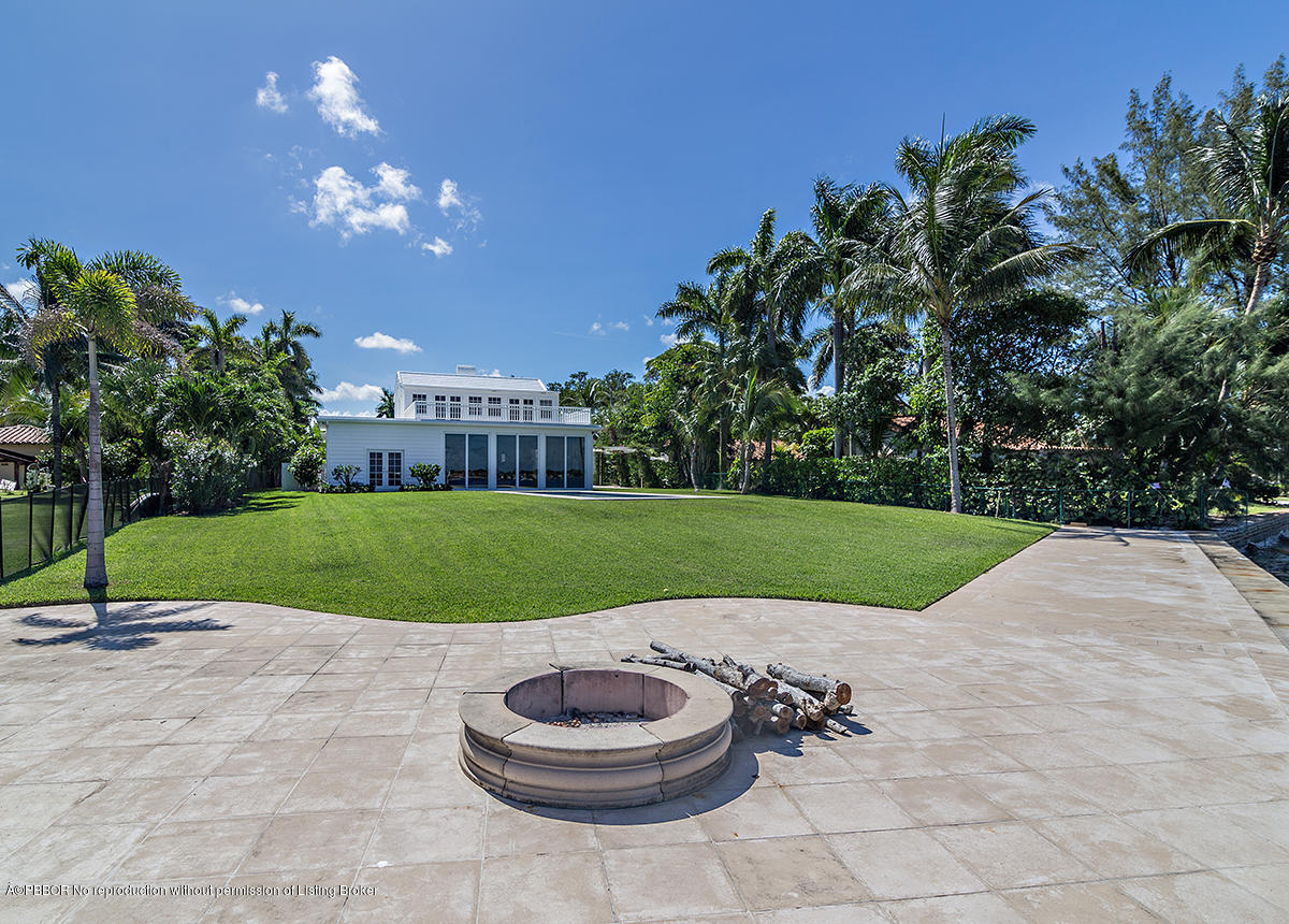 3130 Washington Road West Palm Beach, FL 33405 - Photo 25 of 33 a view of a house with a yard and a garden