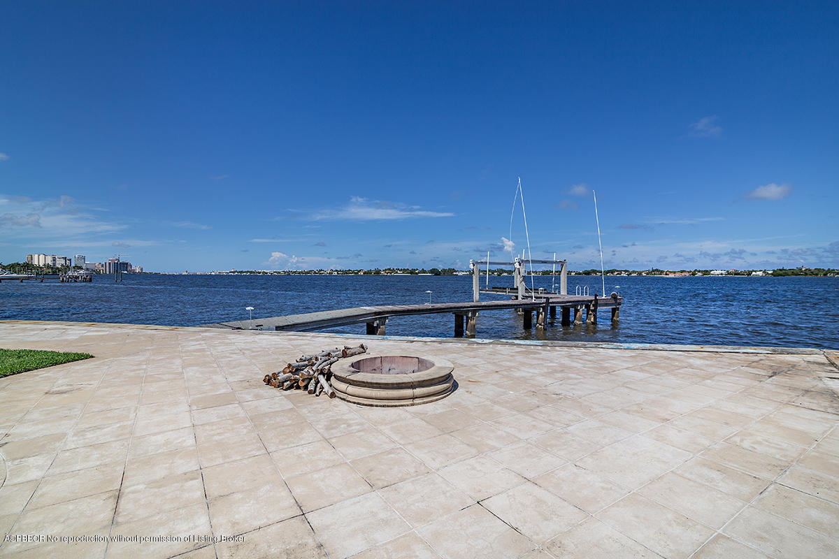 3130 Washington Road West Palm Beach, FL 33405 - Photo 27 of 33 a view of a swimming pool and an outdoor seating