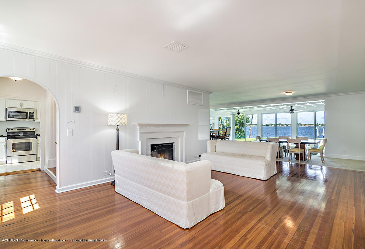 3130 Washington Road West Palm Beach, FL 33405 - Photo 5 of 33 a living room with furniture and a fireplace
