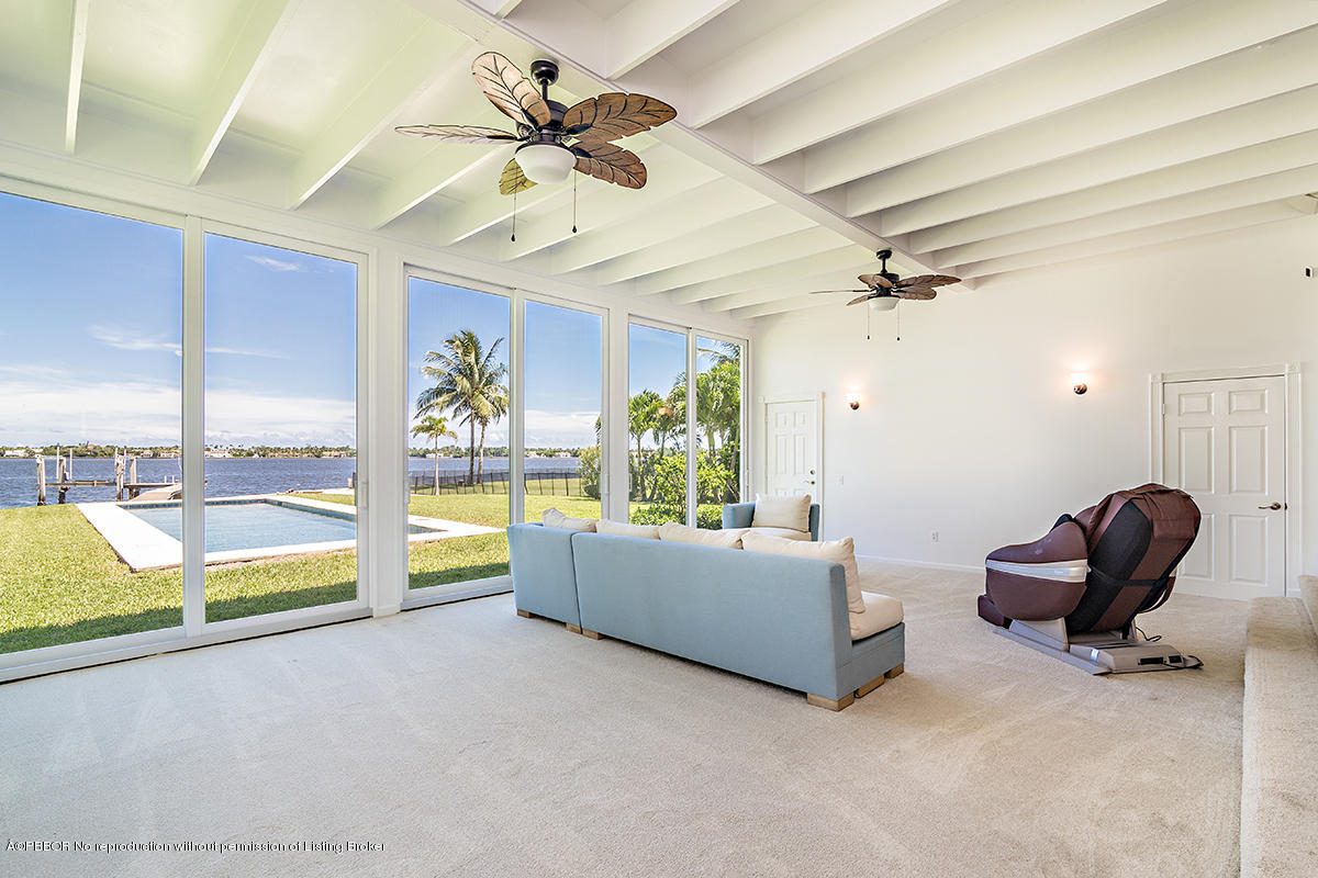 3130 Washington Road West Palm Beach, FL 33405 - Photo 8 of 33 a living room with furniture and a large window