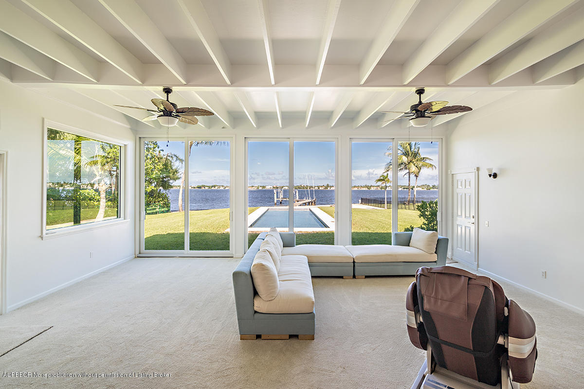 3130 Washington Road West Palm Beach, FL 33405 - Photo 9 of 33 a living room with furniture and a large window