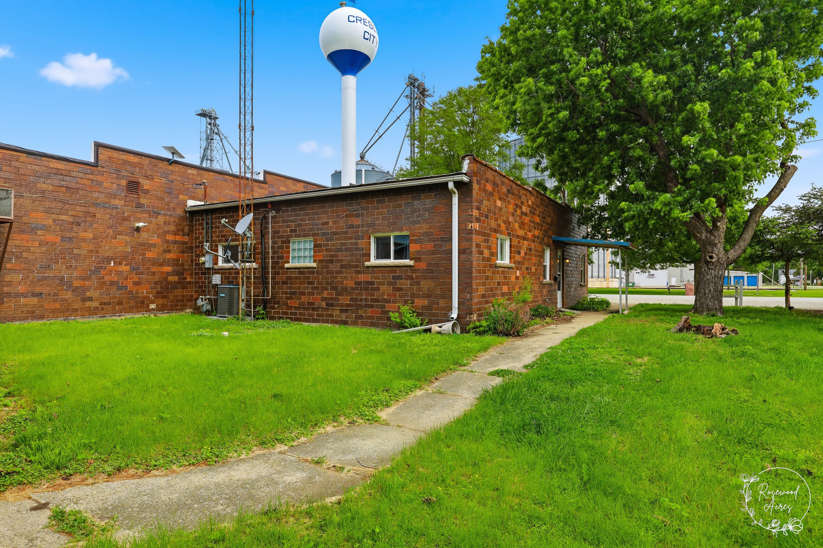 409 Main Street Crescent City, IL 60928 - Photo 18 of 22 a front view of a house with a garden