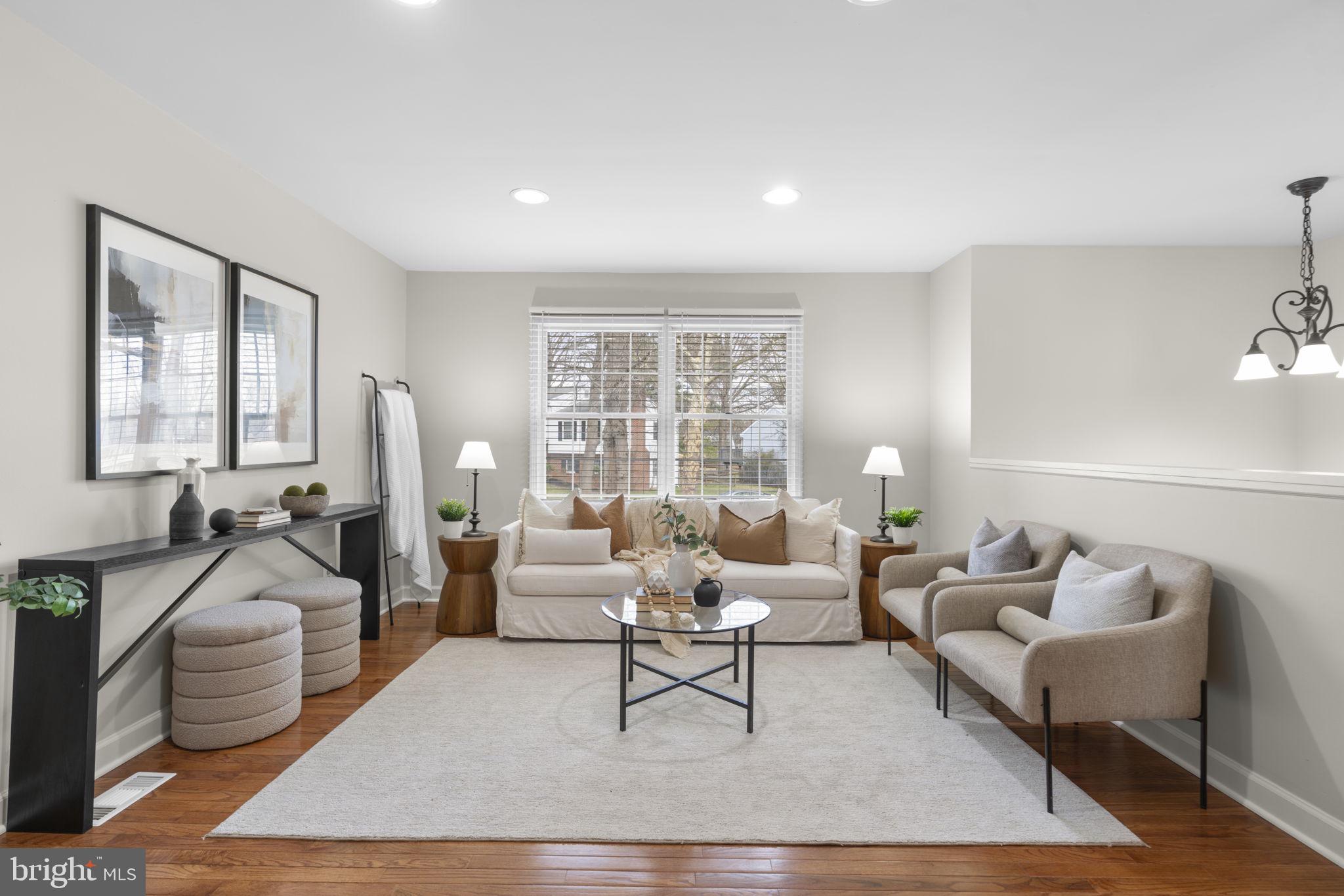 6968 Sunfleck Row Columbia, MD 21045 - Photo 12 of 45 a living room with furniture rug and window