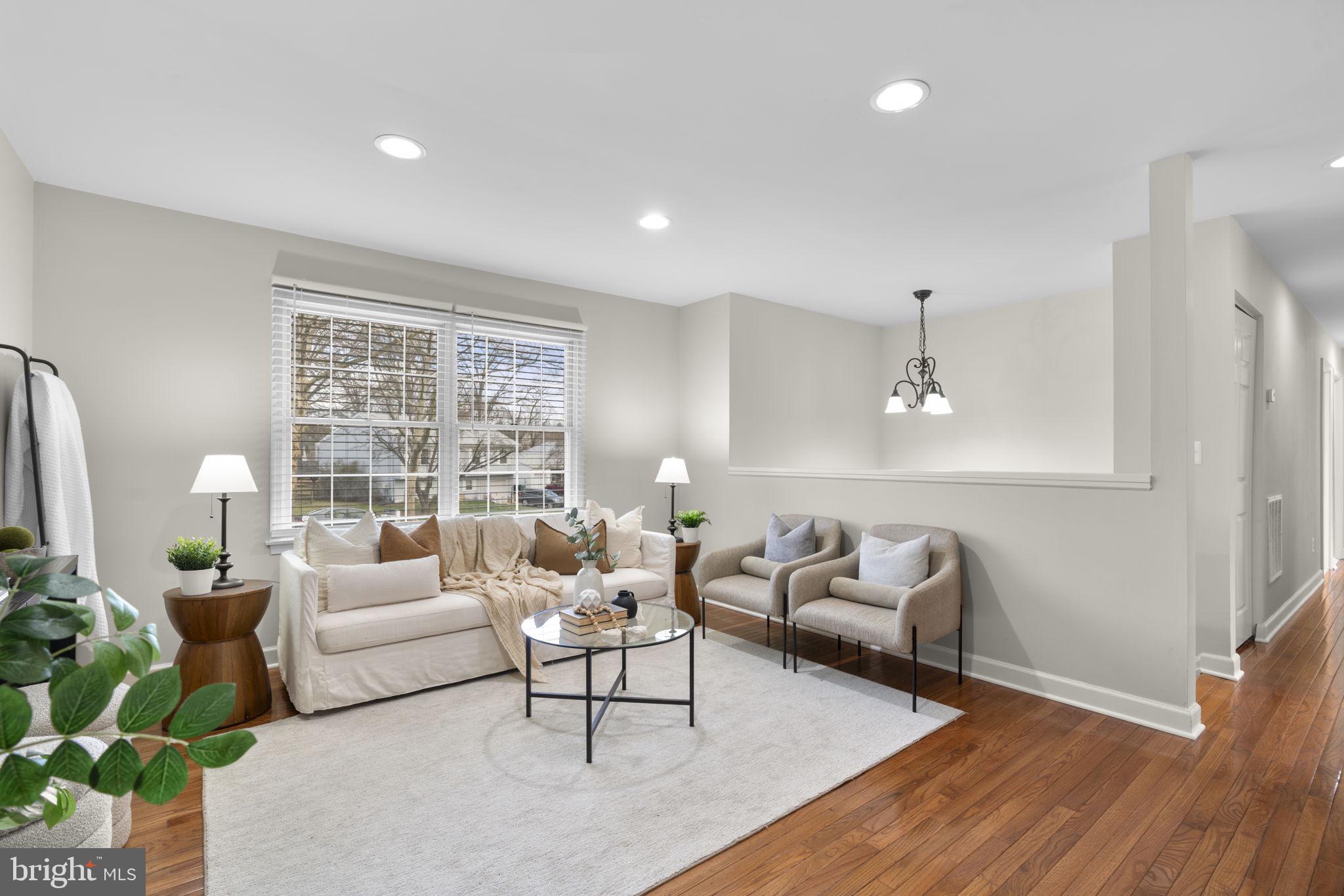 6968 Sunfleck Row Columbia, MD 21045 - Photo 13 of 45 a living room with furniture and a large window