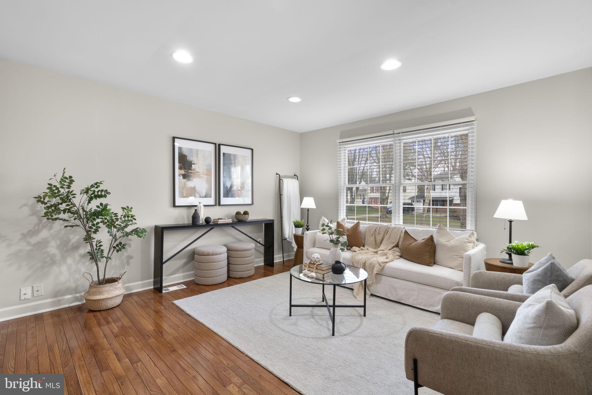 6968 Sunfleck Row Columbia, MD 21045 - Photo 14 of 45 a living room with furniture and a large window