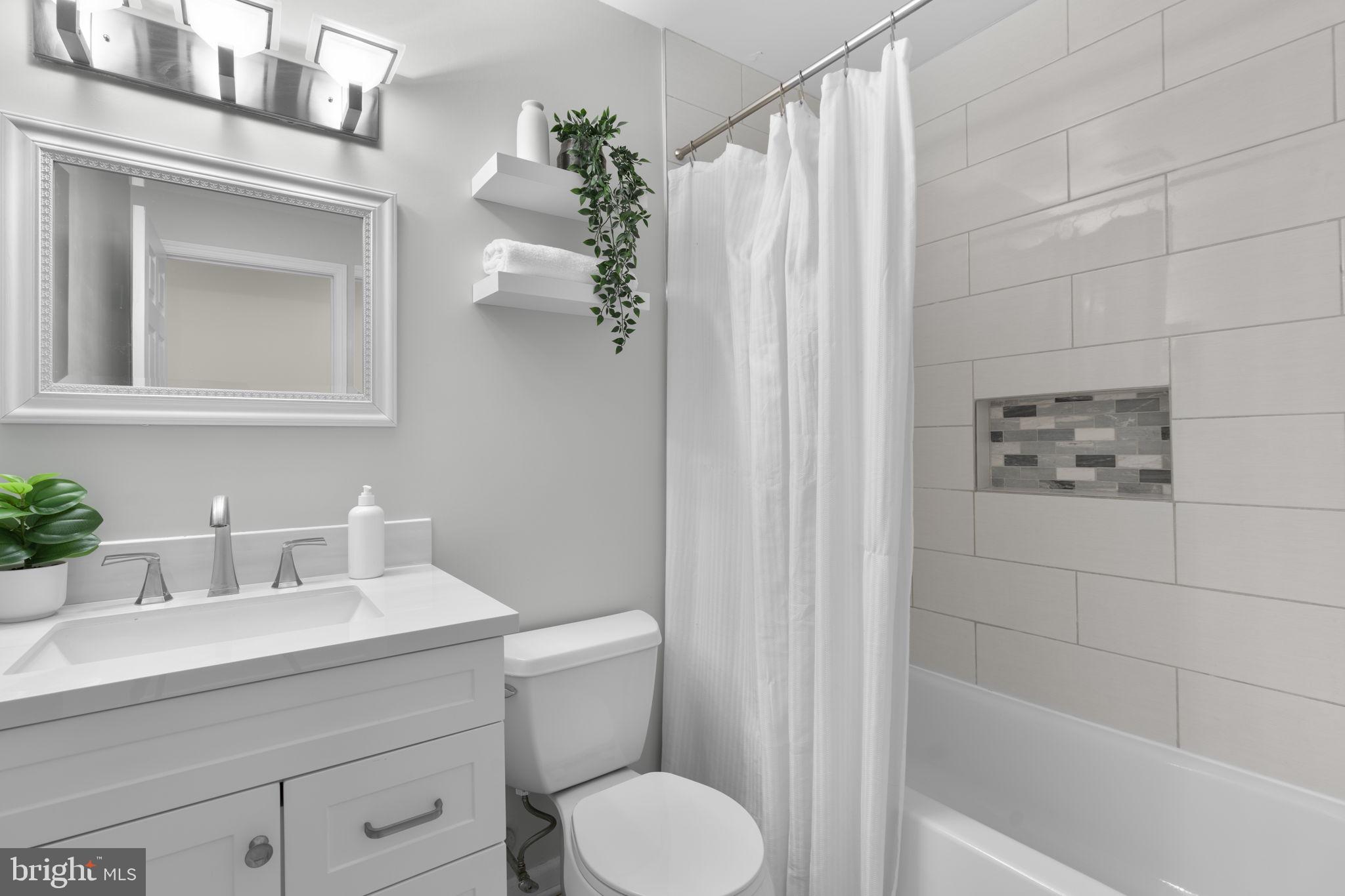 6968 Sunfleck Row Columbia, MD 21045 - Photo 20 of 45 a bathroom with a sink toilet and shower