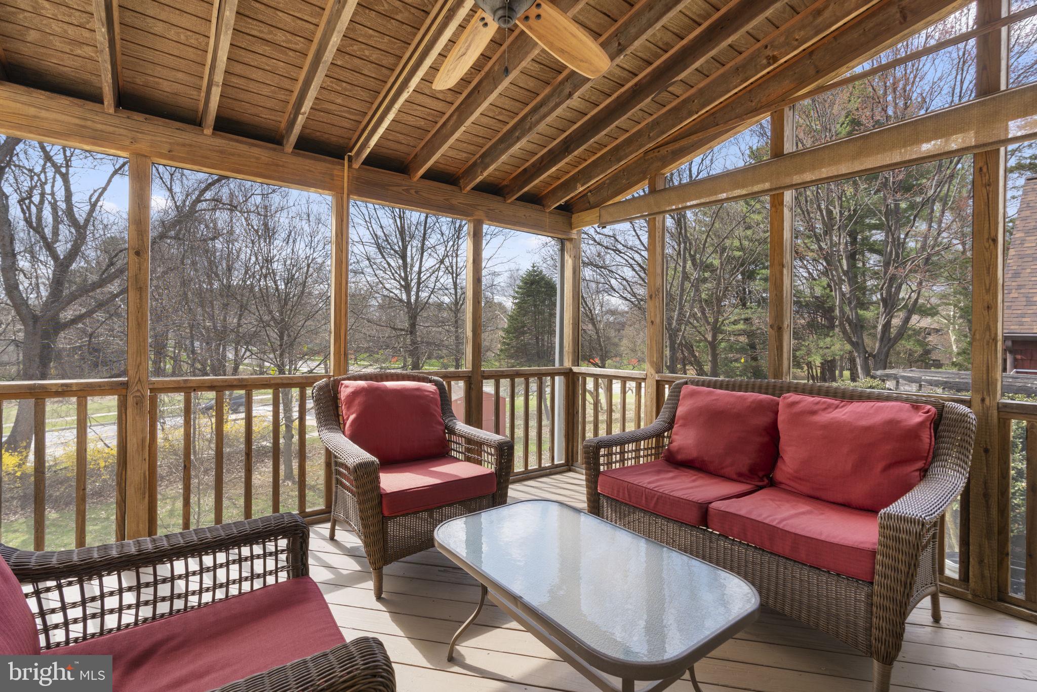 6968 Sunfleck Row Columbia, MD 21045 - Photo 36 of 45 a balcony with furniture and wooden floor