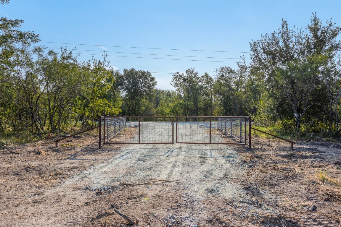 1644 Calvert Tx 77837 Calvert, TX 77837 - Photo 16 of 17 Gate with a forest view