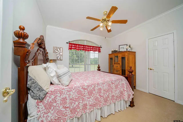 a bed room with a bed and a window