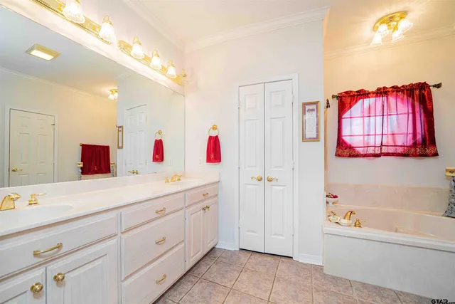 a bathroom with a bathtub sink and a mirror