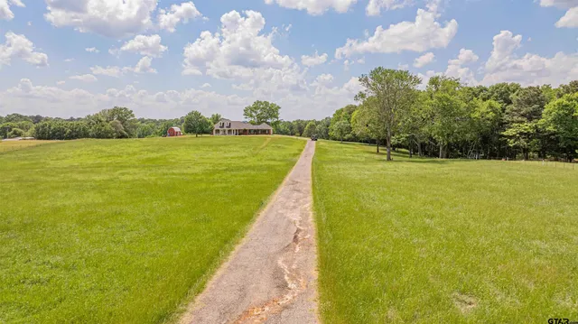 a view of a lake with a big yard