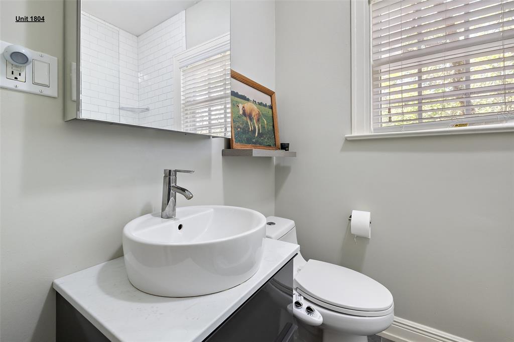 1806 Pearl Street Austin, TX 78701 - Photo 16 of 19 Bathroom featuring a contemporary vessel sink, chrome faucet, and vanity with a light-toned countertop