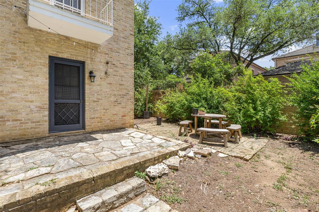 1806 Pearl Street Austin, TX 78701 - Photo 17 of 19 Stone patio with steps leading to a private outdoor area