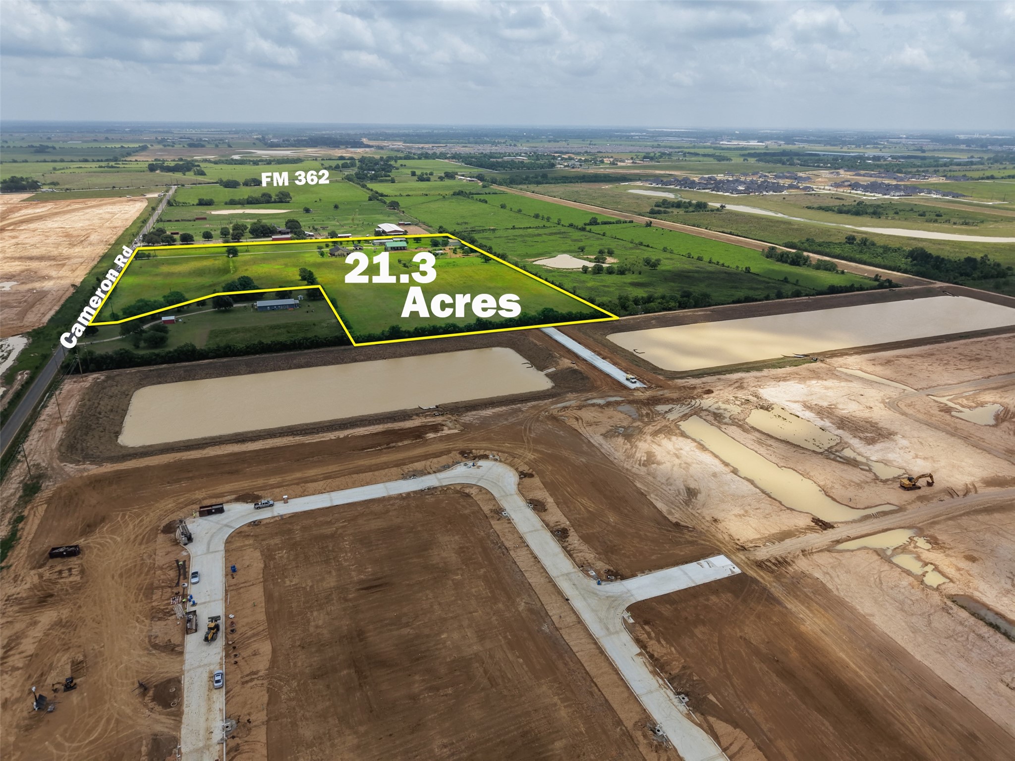 33737 Cameron Road Waller, TX 77484 - Photo 10 of 24 This aerial photo showcases a 21.3-acre property bordered by Cameron Rd and FM 362. The land features lush greenery and is adjacent to developing areas, offering a blend of rural charm and potential growth.