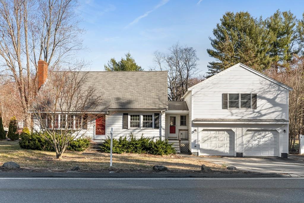 294 Salem Road Billerica, MA 01821 - Photo 1 of 25 a view of a white house with a large tree and plants