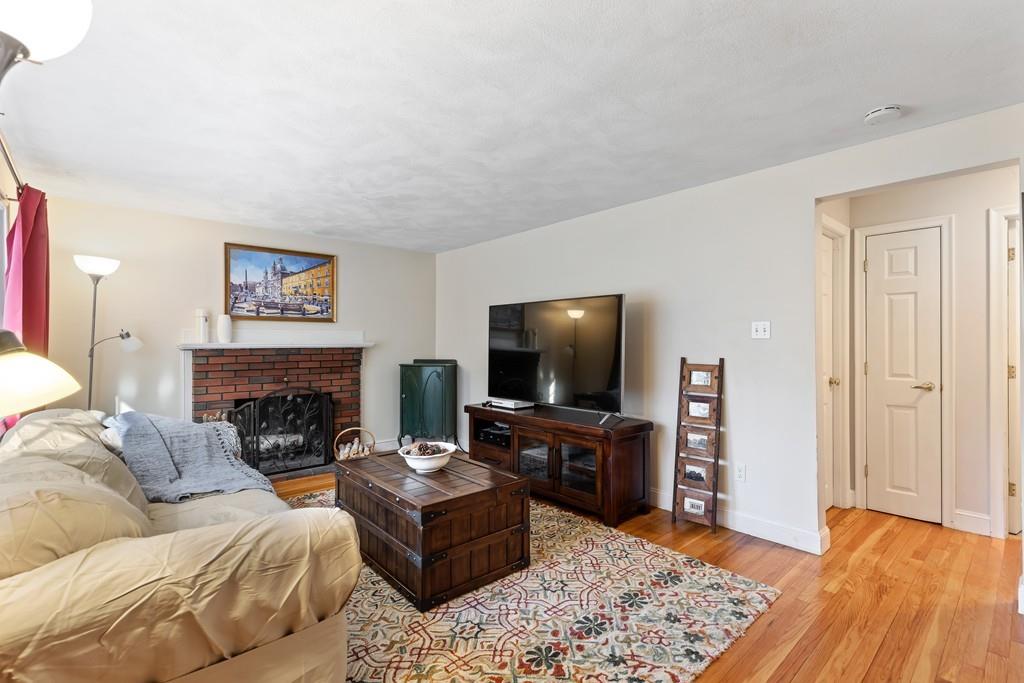 294 Salem Road Billerica, MA 01821 - Photo 12 of 25 a living room with furniture and a flat screen tv