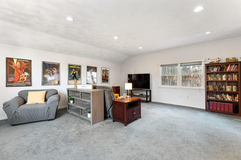294 Salem Road Billerica, MA 01821 - Photo 17 of 25 a living room with furniture and a flat screen tv