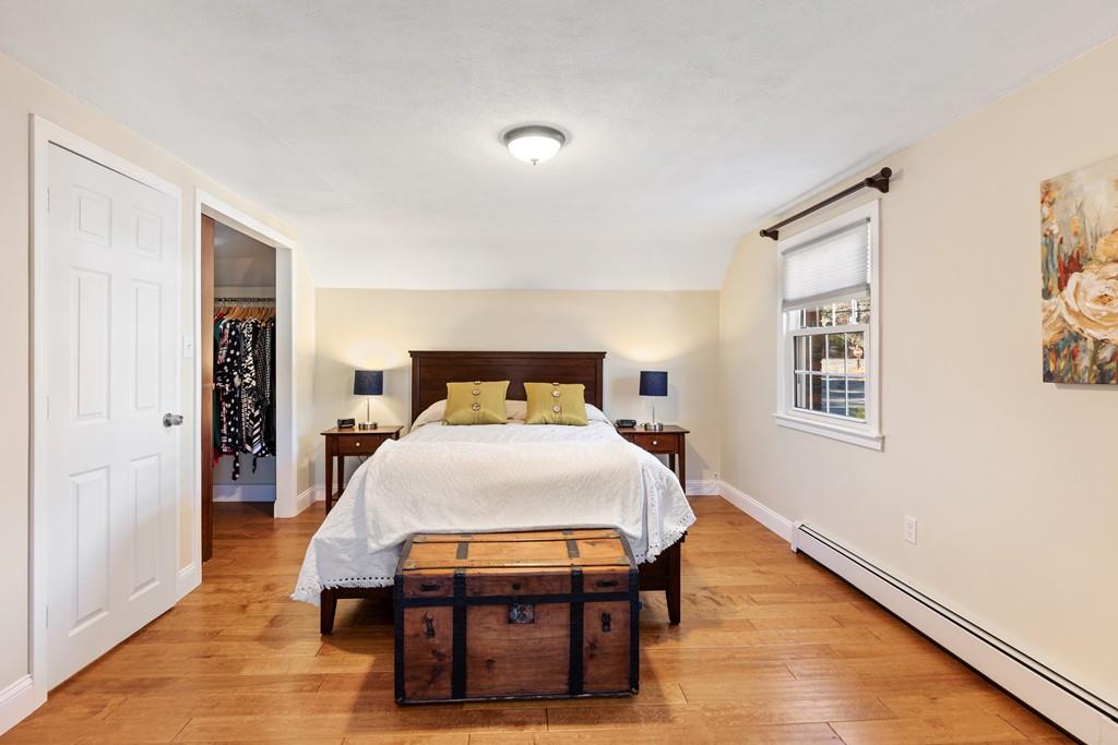 294 Salem Road Billerica, MA 01821 - Photo 18 of 25 a bedroom with a bed and wooden floor
