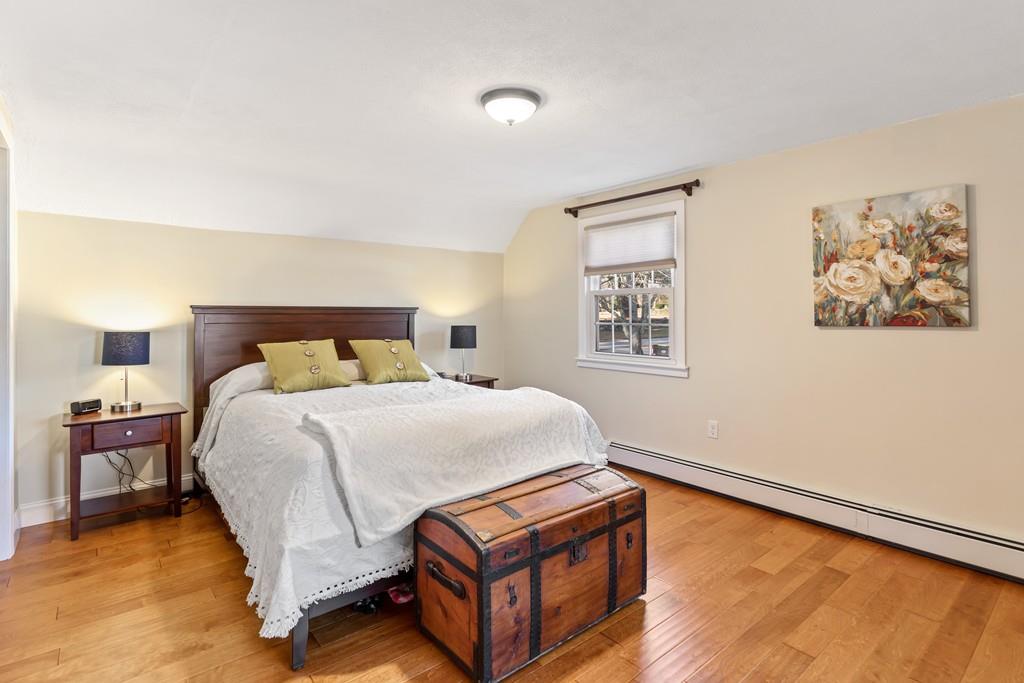 294 Salem Road Billerica, MA 01821 - Photo 19 of 25 a bedroom with a bed and wooden floor