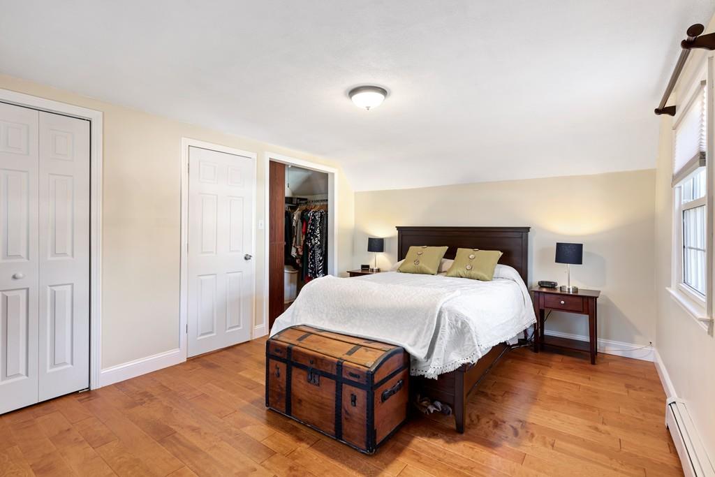 294 Salem Road Billerica, MA 01821 - Photo 20 of 25 a bedroom with a bed and wooden floor