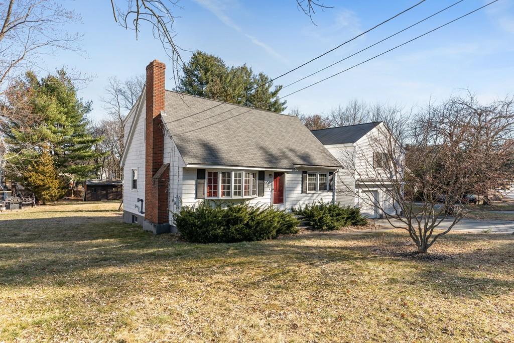 294 Salem Road Billerica, MA 01821 - Photo 2 of 25 a view of a house with a yard