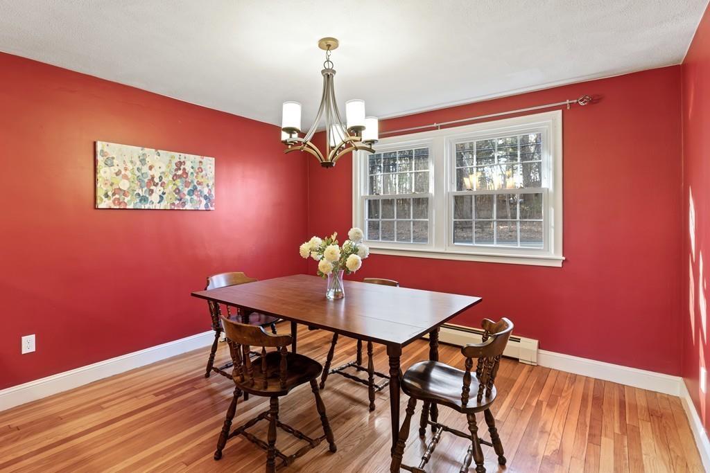294 Salem Road Billerica, MA 01821 - Photo 9 of 25 a view of a dining room with furniture wooden floor and chandelier