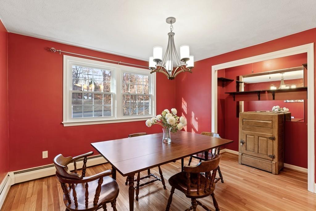 294 Salem Road Billerica, MA 01821 - Photo 10 of 25 a view of a dining room with furniture window and wooden floor