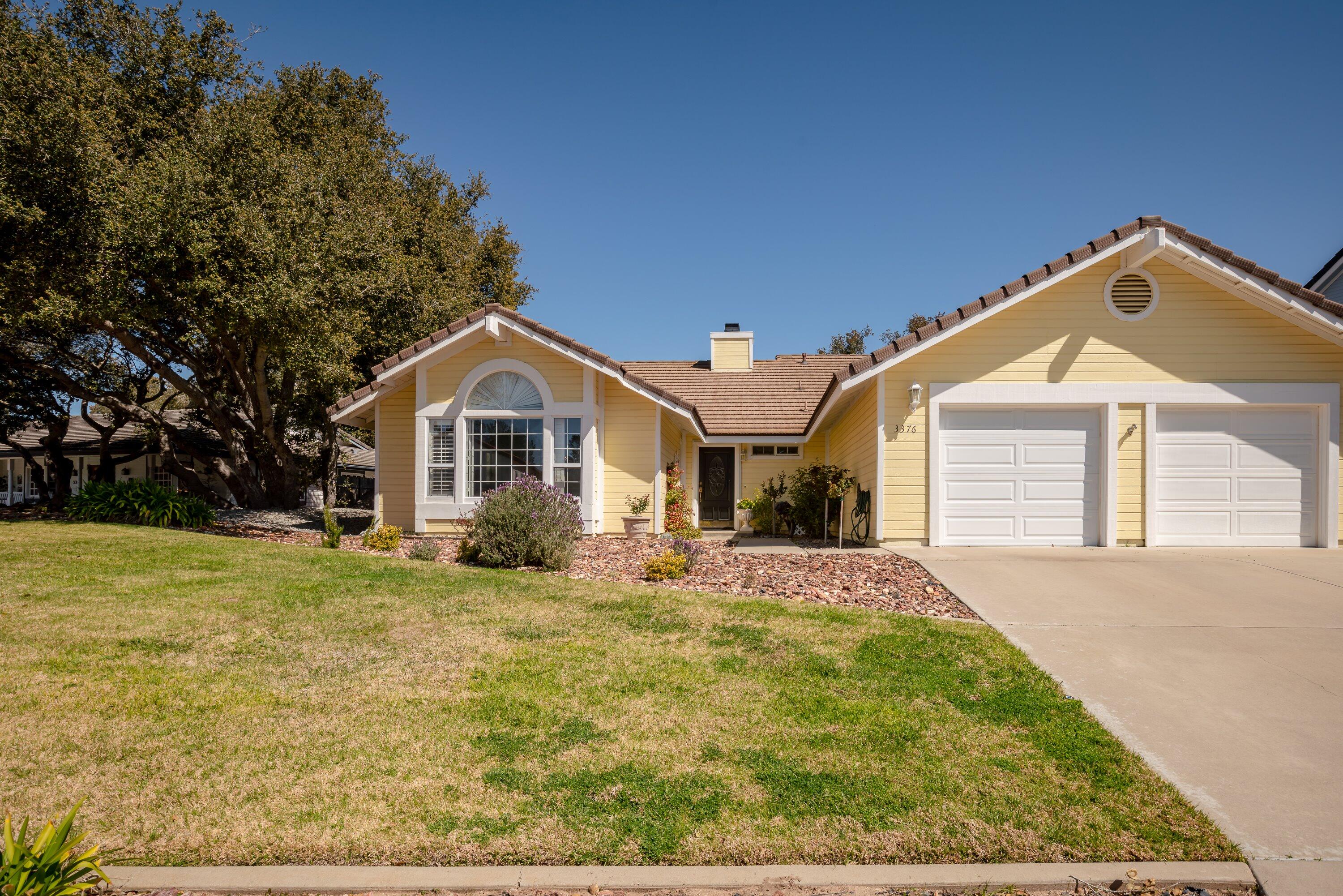 3376 Shepherd Drive Lompoc, CA 93436 - Photo 3 of 27 a front view of a house with a yard and garage