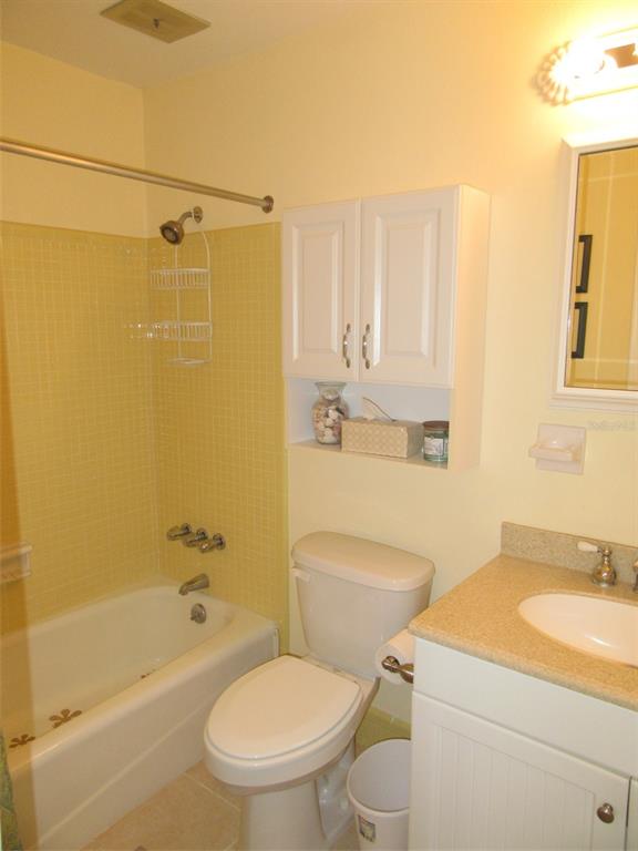 8158 Fay Avenue North Port, FL 34287 - Photo 17 of 23 a bathroom with a granite countertop toilet sink and shower
