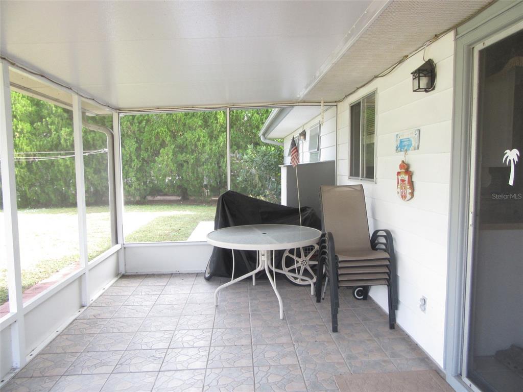 8158 Fay Avenue North Port, FL 34287 - Photo 20 of 23 a living room with furniture and a large window