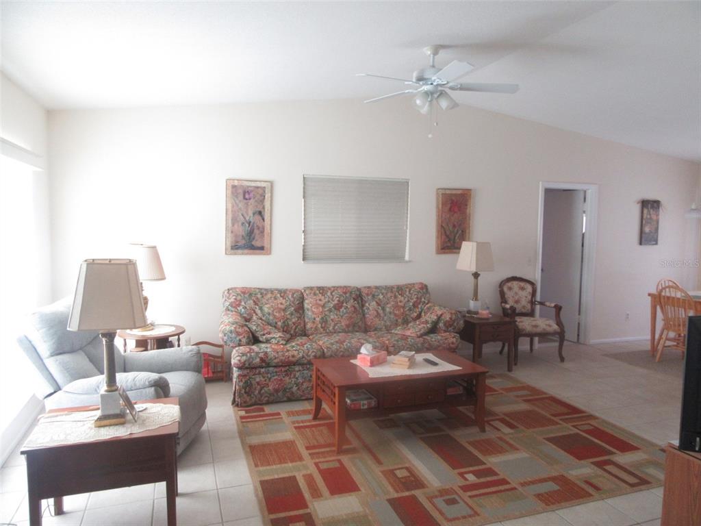 8158 Fay Avenue North Port, FL 34287 - Photo 2 of 23 a living room with furniture and a rug