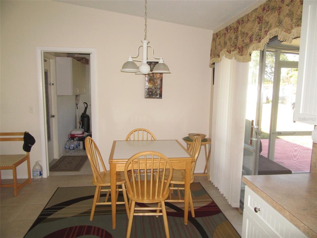 8158 Fay Avenue North Port, FL 34287 - Photo 9 of 23 a view of a dining room with furniture window and outside view