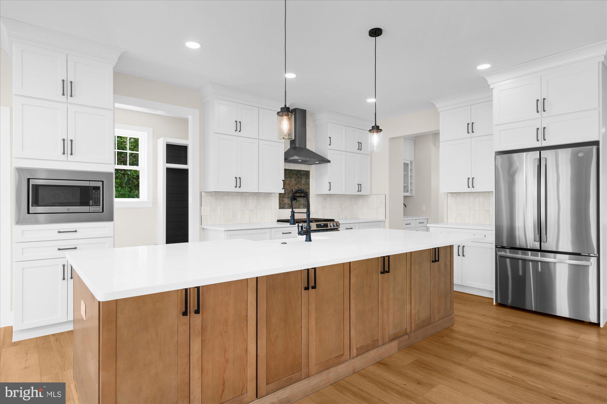 394 Renninger Road Perkiomenville, PA 18074 - Photo 20 of 41 a kitchen with stainless steel appliances sink refrigerator and microwave