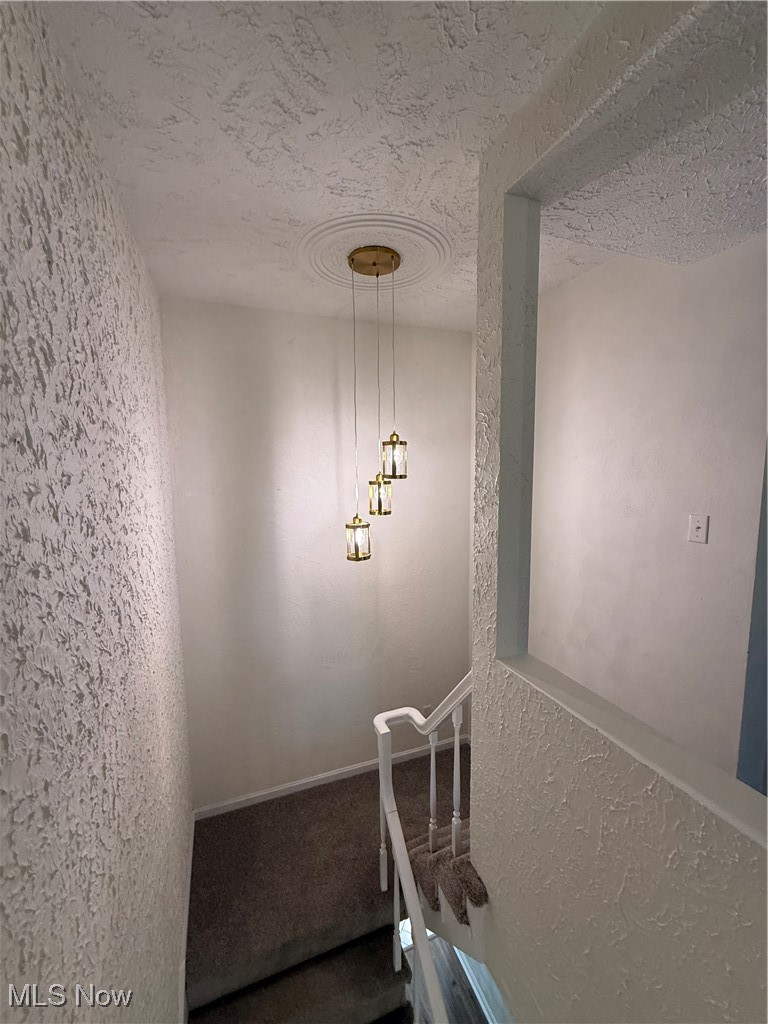 522 North 3rd Street Toronto, OH 43964 - Photo 20 of 47 Stairs featuring a textured wall and a textured ceiling