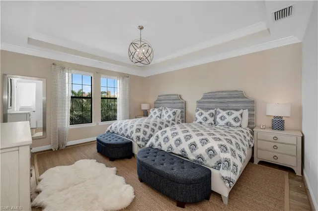 a bedroom with bed and window