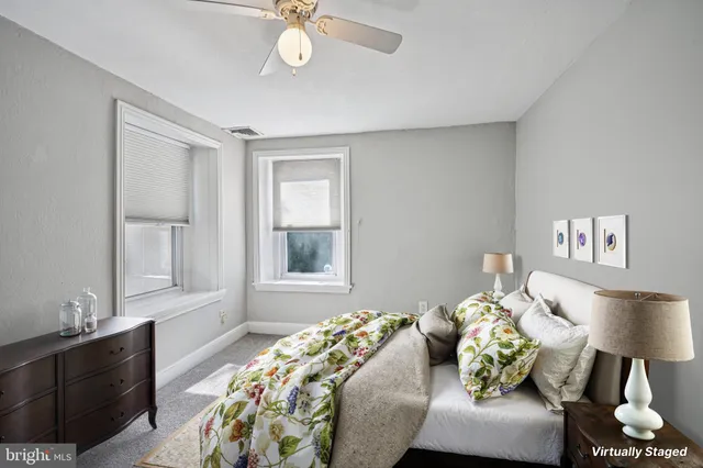 a bedroom with bed and a window