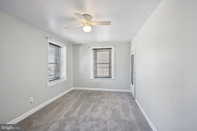 an empty room with windows