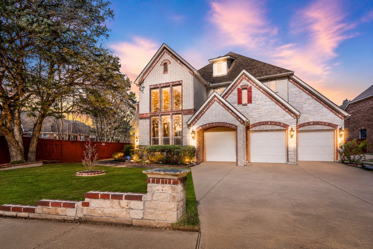 3903 Remington Road Cedar Park, TX 78613 - Photo 2 of 29 A grand entrance awaits with this home's triple garage doors and striking brick and stone façade.