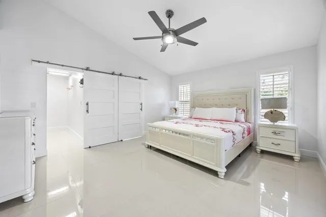 a spacious bathroom with a double vanity sink and a mirror