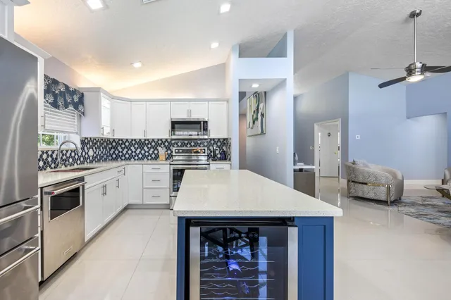 a outdoor space with patio the couches and dining table with garden view