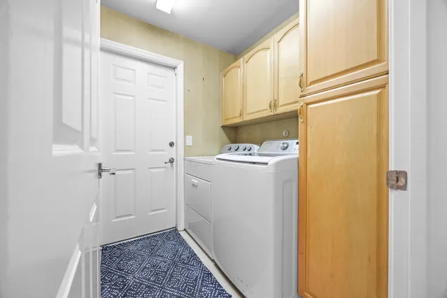 a view of a house with backyard and porch