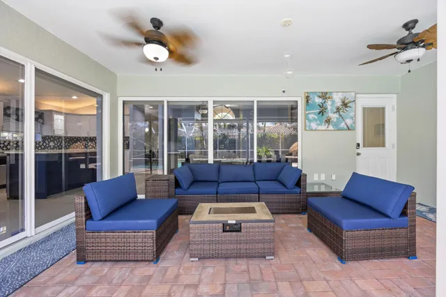 a house with potted plants in front of it
