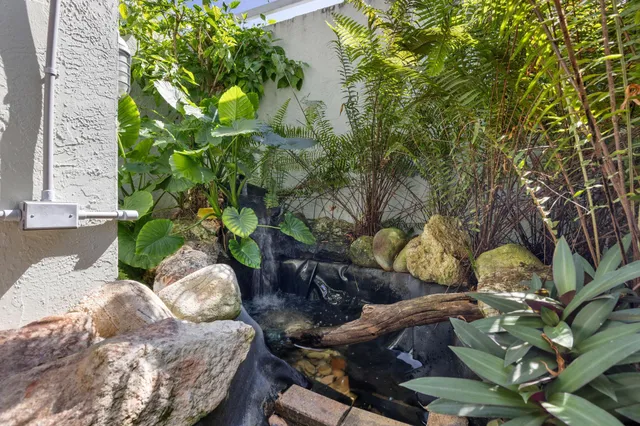 an aerial view of a houses with city view