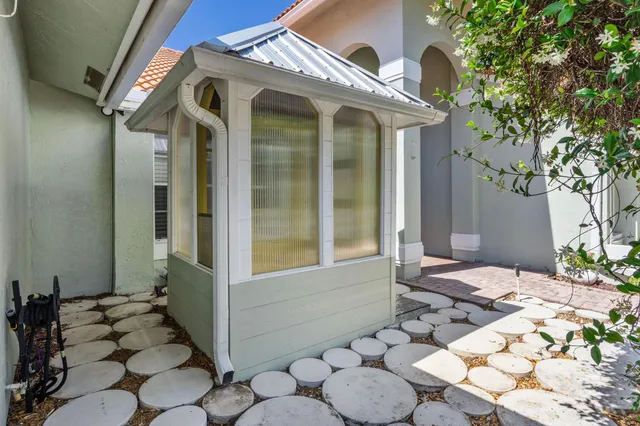 an aerial view of a houses with city view