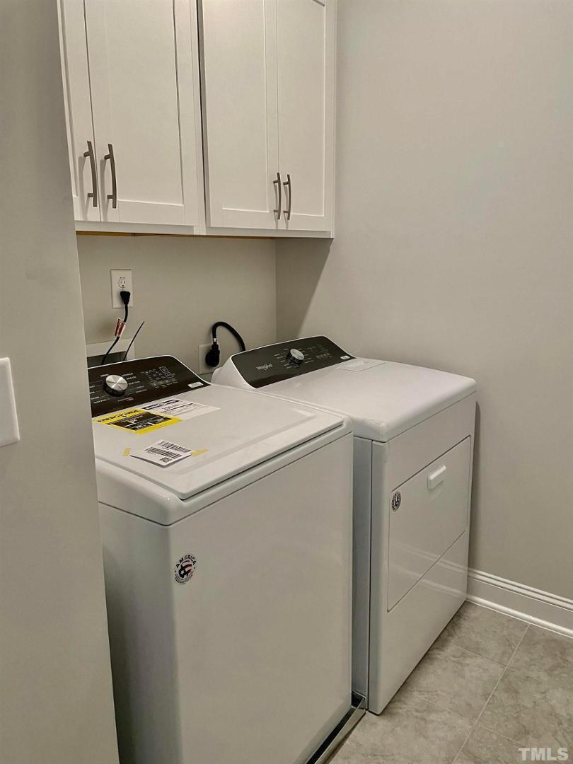 8425 Garnet Rose Drive Raleigh, NC 27615 - Photo 11 of 11 a utility room with dryer and washer