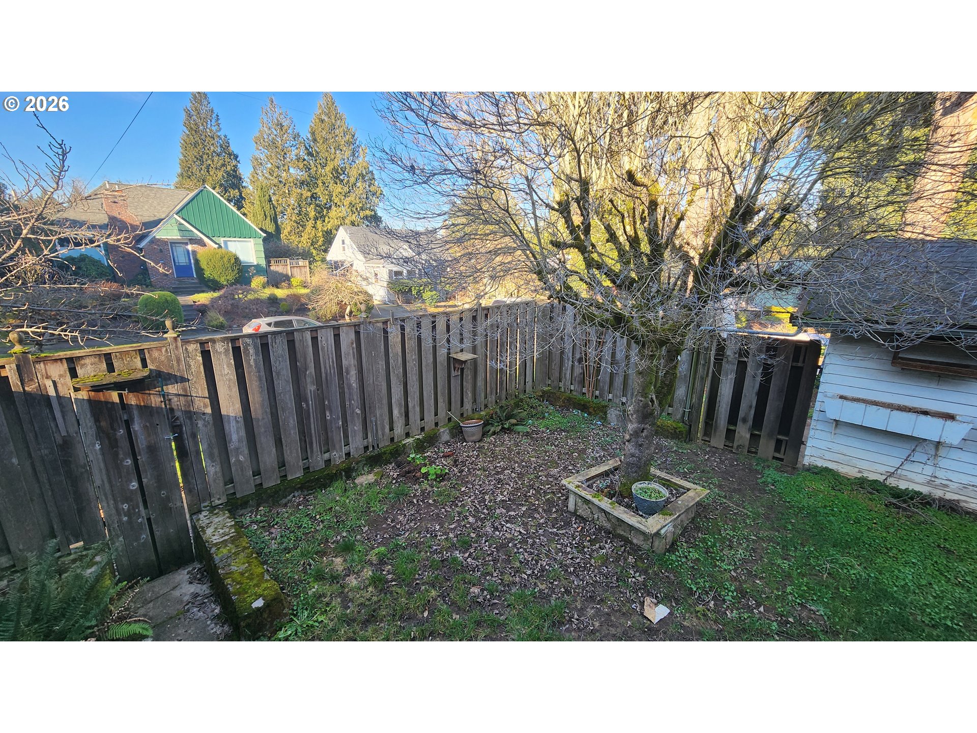 2605 Northeast Jarrett Street Portland, OR 97211 - Photo 4 of 23 a view of a backyard with wooden fence