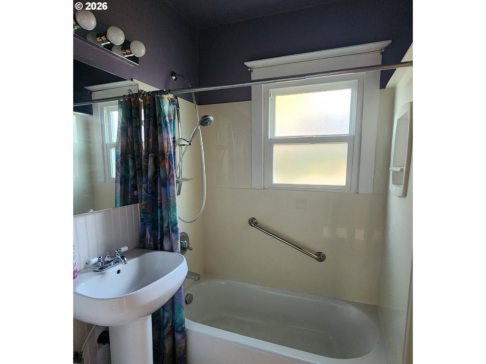2605 Northeast Jarrett Street Portland, OR 97211 - Photo 8 of 23 a bathroom with a sink mirror toilet and bathtub