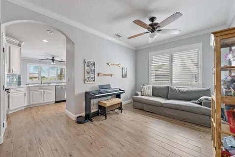 a living room with furniture and a large window